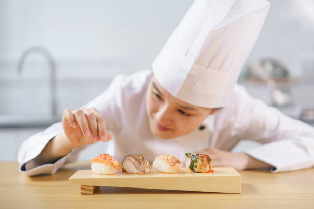 istock The female chef making the sushi dish 1156107837