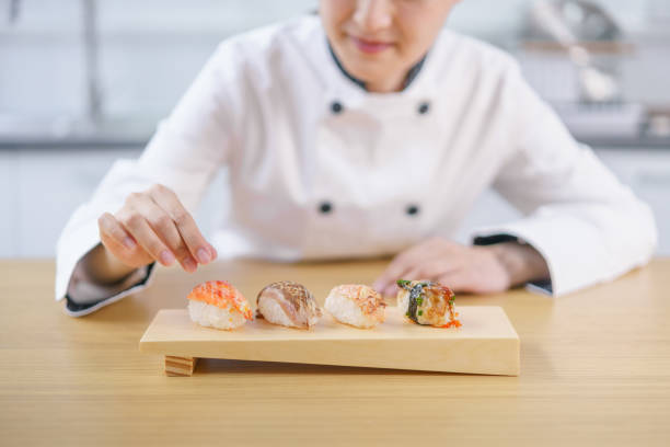 istock The female chef making the sushi dish 1156107879