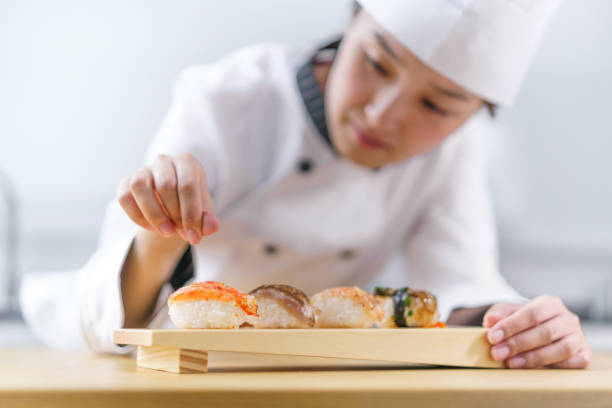 istock The female chef making the sushi dish 1156107881