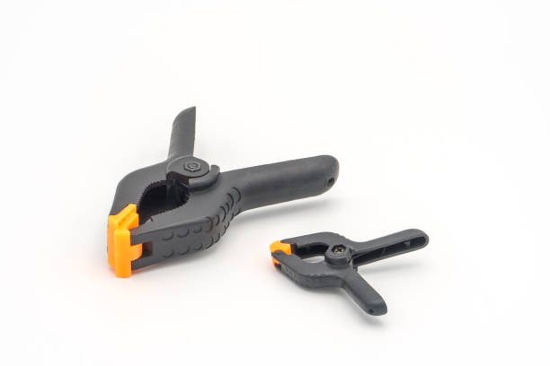 istock Black plastic clamps for joinery and photography 1156107897