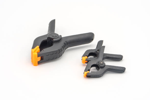 istock Black plastic clamps for joinery and photography 1156107900