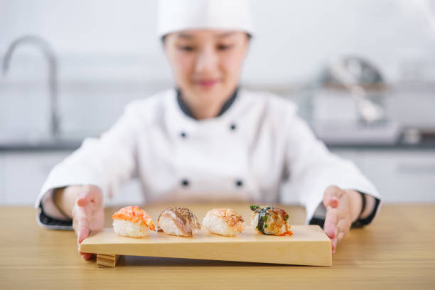 istock The female chef making the sushi dish 1156107910
