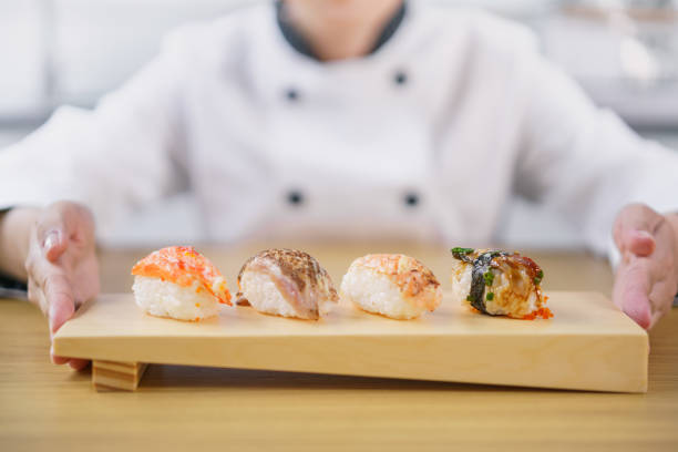 istock The female chef making the sushi dish 1156107923