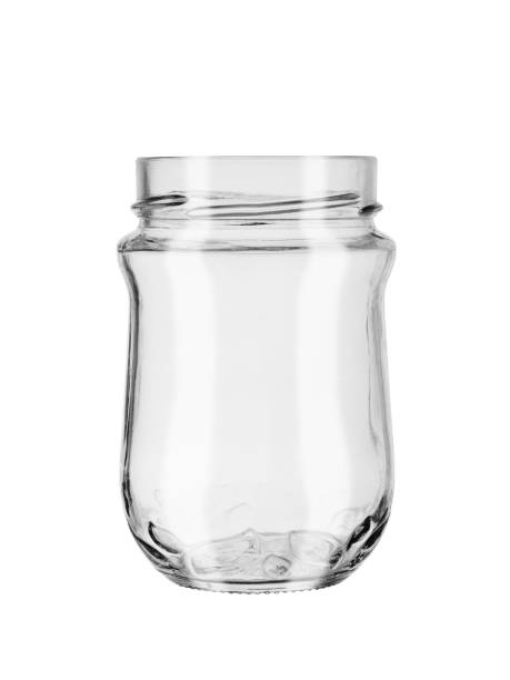 istock empty glass jar without cover isolated on a white background with patches of light 1156108739