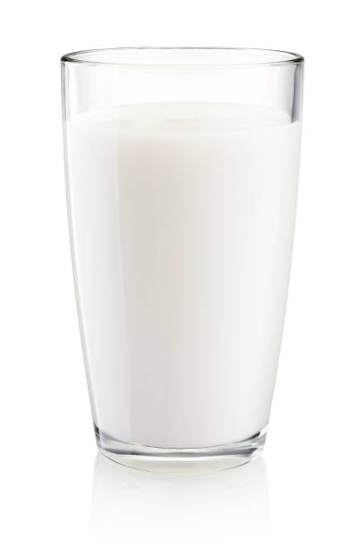 istock Glass of milk isolated on white background 1156108757