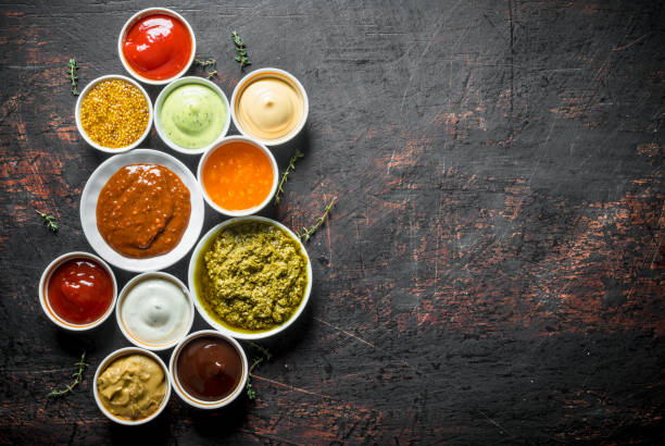 istock Barbecue sauce, pesto, mayonnaise, mustard with thyme sprigs. 1156108841