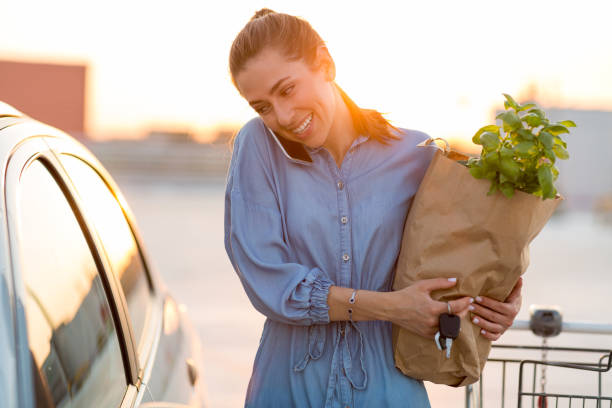 istock Happy girl packing groceries 1156109692
