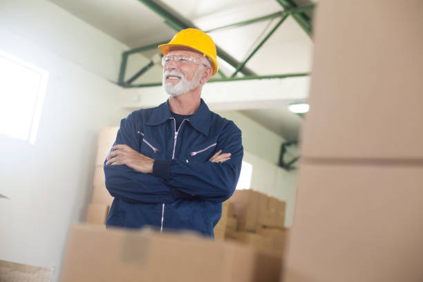 istock Senior man working in a warehouse 1156111054