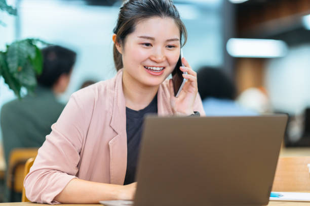 istock Business woman working in co-working space 1156113007