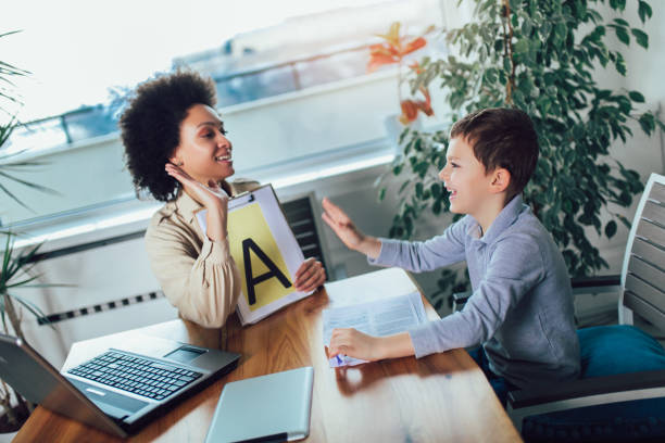 istock Shot of a speech therapist during a session with a little boy 1156113979