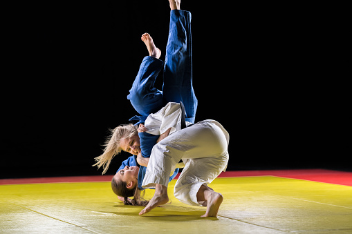 Female Judo Players Competing In Judo Match