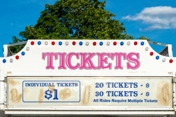 Ticket Booth for a Traveling Carnival This booth sells tickets at a traveling carnival.  The lights and signage advertise tickets for sale and the price of each ticket. box office photos stock pictures, royalty-free photos & images