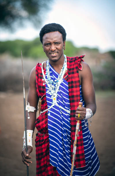 istock young, handsome Maasai man in his traditional outfit 1156115714