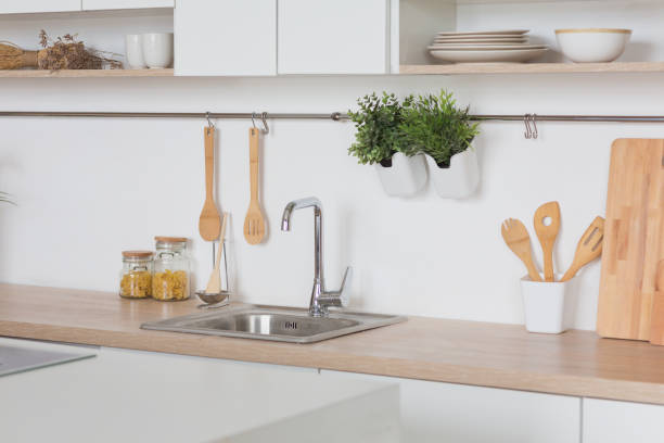 istock White kitchen Interior in scandinavian style with kitchenware and green plants 1156117482