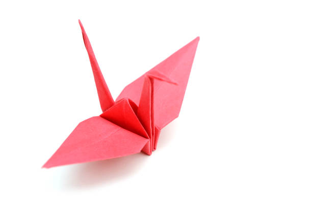 istock Red Origami Crane on a white background 1156119841