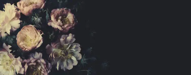 Photo of Vintage bouquet of beautiful peonies on black. Floristic decoration. Floral background. Baroque old fashiones style. Natural flowers pattern wallpaper or greeting card