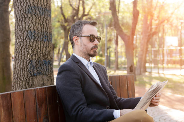 istock Businessman reading newspaper 1156125815