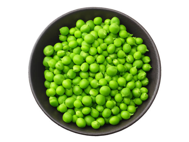 istock fresh green peas in a black plate isolated on white background. top view 1156126476