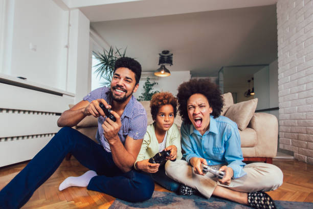 istock Family Playing Video Games Together 1156127576