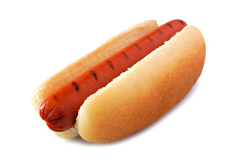 Hot dog with barbecue grill marks, side view isolated on a white background