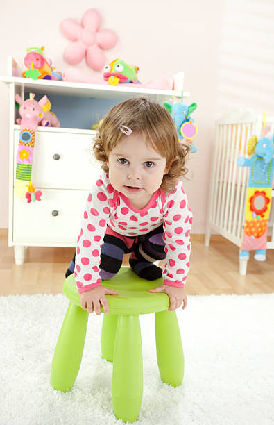 istock Cute Curly Girl Playing In Her Room 115612973