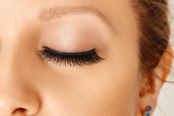istock Closed female eye with long false eyelashes 1156132475