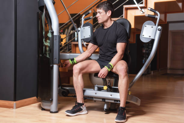 istock Handsome muscular man ready to work out at press chest machine. Chest workouts. 1156133277