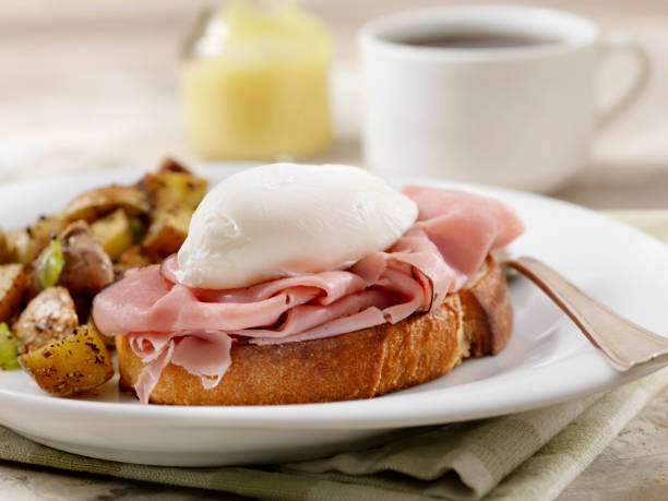 istock Eggs Benedict with Black Forest Ham and Hash Browns on Grilled French Bread 1156136717