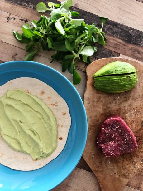 Tortilla with sliced beef salad and guacamole