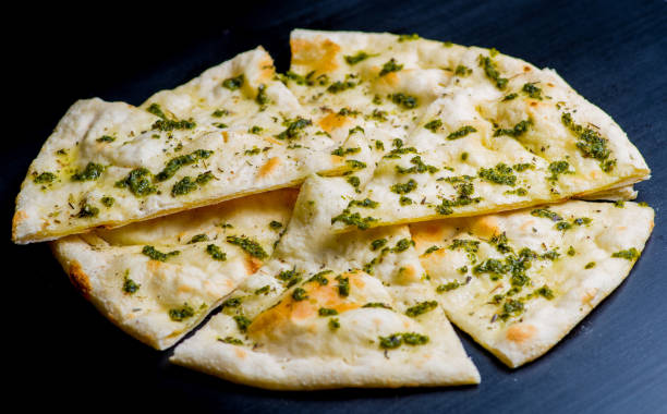 istock vegan pizza on a dark background 1156137285
