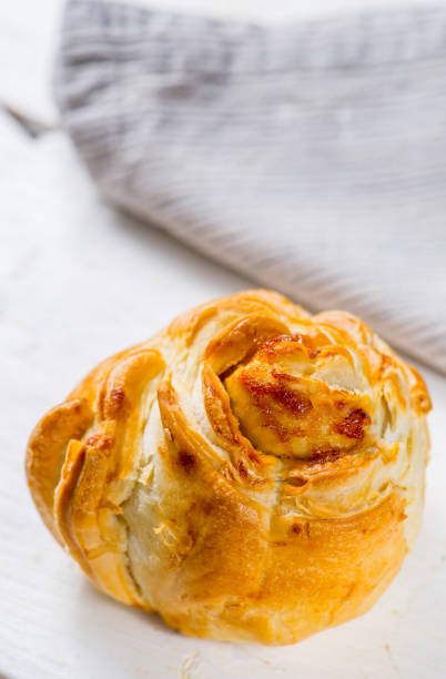 istock Fresh pastries on a white background close-up. Several rolls with filling on a white background 1156137307