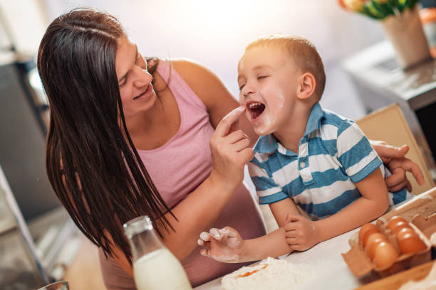 istock Pregnant mother and her son enjoying in kitchen 1156138305