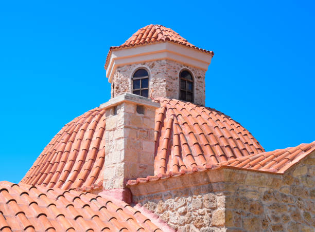 On the island of Tinos, in the Cyclades, in the heart of the Aegean Sea and at the foot of mount exobourgo, view of the golden dome of an orthodox church near the village of Tripotamos.