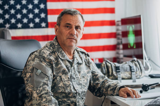 istock Senior soldier sitting at the office 1156139324