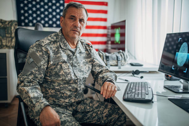 istock Senior soldier sitting at the office 1156139333