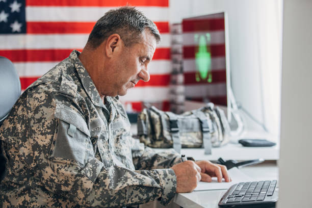 istock Senior soldier doing paperwork at the office 1156139561