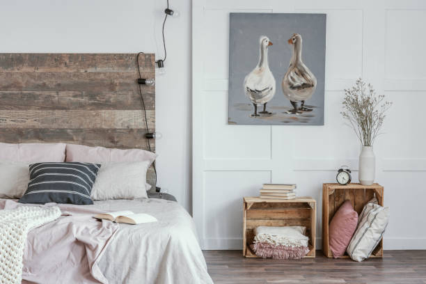 istock Black and white pillow on pastel pink and beige bedding 1156140409