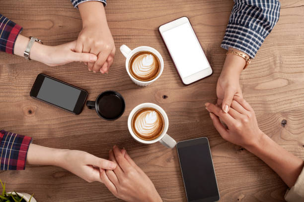 istock Three young women enjoy coffee at a coffee shop 1156141328