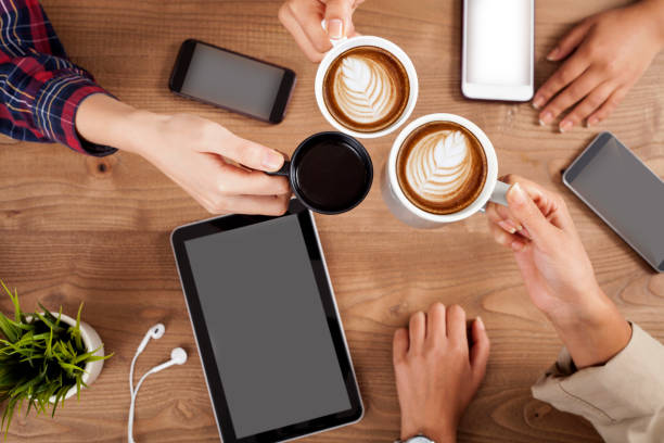 istock Three young women enjoy coffee at a coffee shop 1156141420