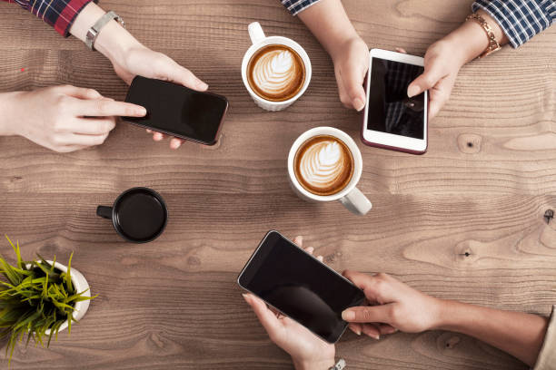 istock Three young women enjoy coffee at a coffee shop 1156141457