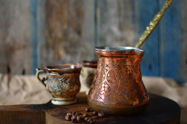 istock Colorful fragrant coffee serving. Authentic coffee pot and cups. 1156142450