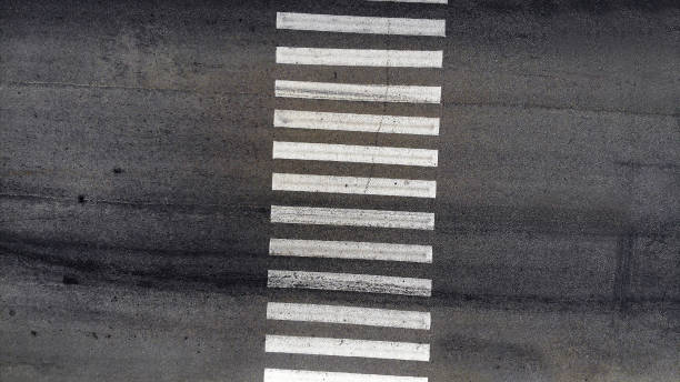 istock Pedestrian crosswalk zebra with no people, aerial, top view 1156142641
