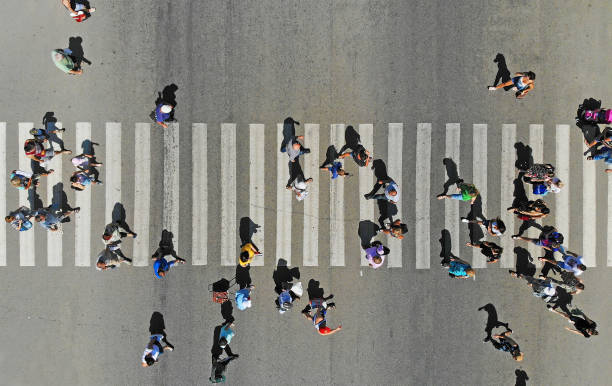 istock Aerial. People crowd on pedestrian crosswalk. Top view. 1156142681