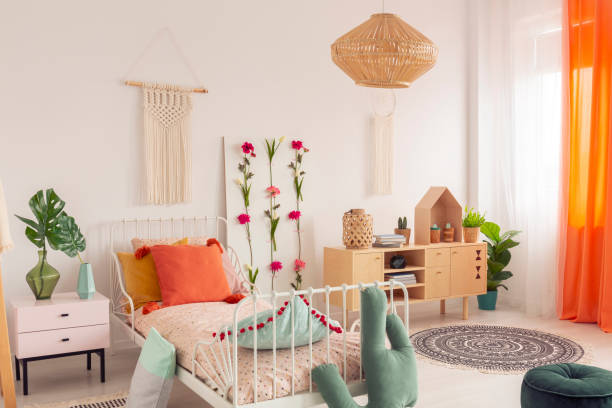 istock Wicker chandelier under the ceiling of chick bedroom with ethno design 1156142821