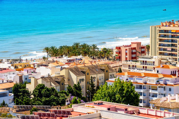 Torremolinos, Andalusia, Spain view The Mediterranean Sea behind the buildings of Torremolinos, Province of Malaga, Andalusia, Spain, elevated view from the Parque de la Bateria observation tower torremolinos beach stock pictures, royalty-free photos & images