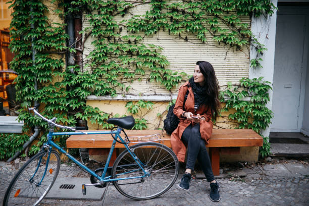 istock text messaging while cycling in Berlin Kreuzberg 1156149183