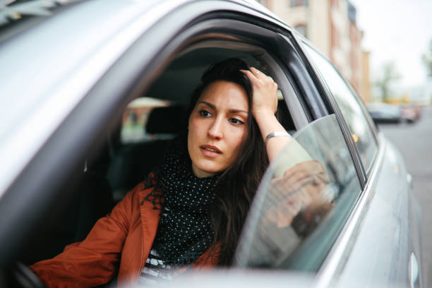 stuck in Berlin traffic Young commuter woman driving in Berlin Mitte. graffic stock pictures, royalty-free photos & images