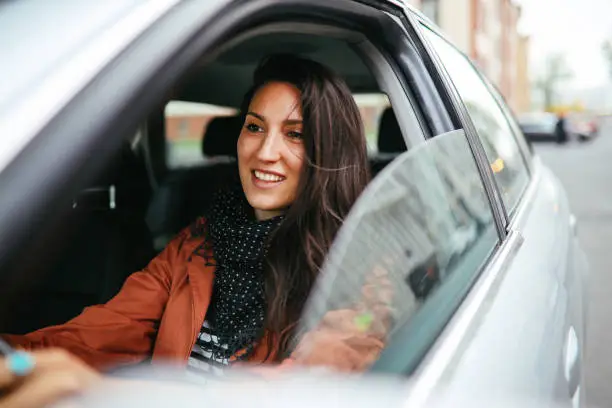 Young commuter woman driving in Berlin Mitte.