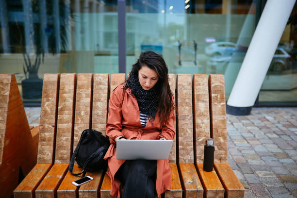 istock young woman working on the go in Berlin 1156151991