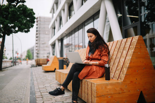 young woman working on the go in Berlin